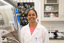 researcher poses for a photo in a lab